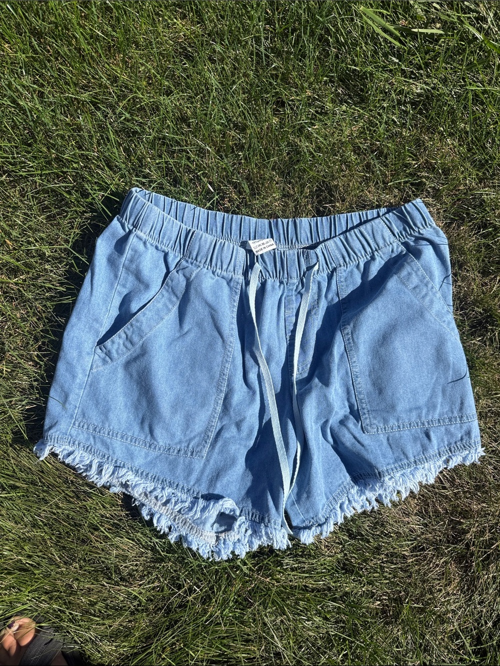 Women's Light Blue Denim Drawstring Fringe Hem Shorts